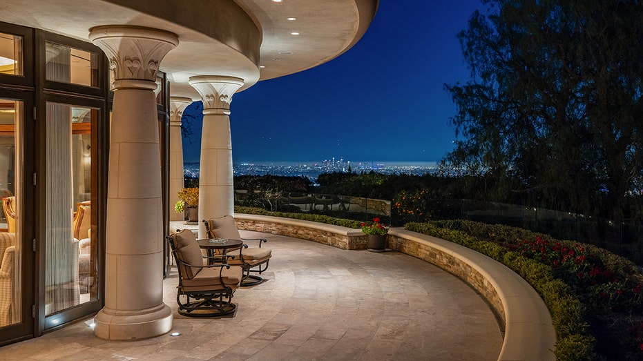 The living room opens up onto an outdoor terrace.