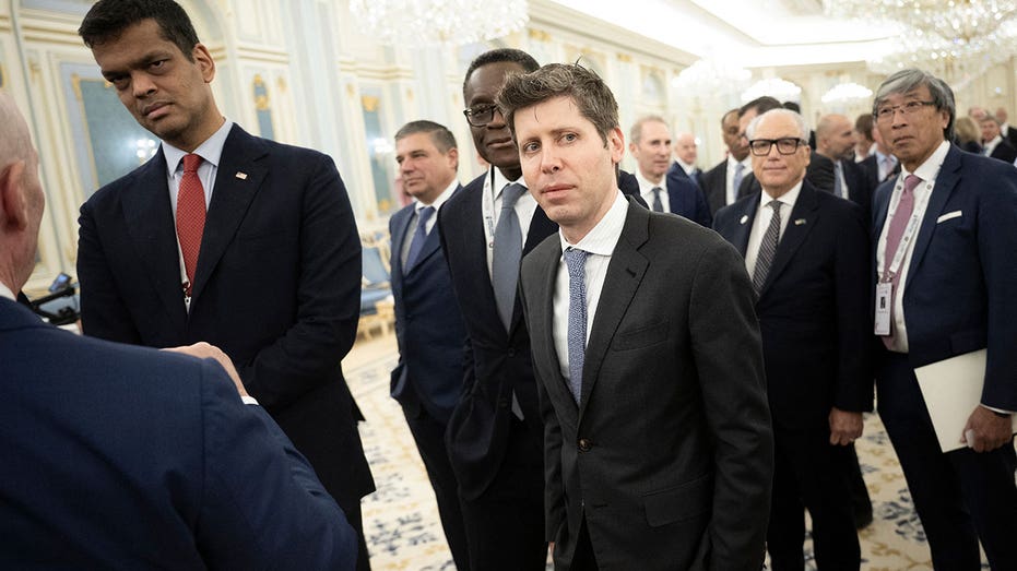 OpenAI CEO Sam Altman (C) and ImmunityBio Executive Chairman Patrick Soon-Shiong (R) wait to meet the Saudi Crown Prince at the Royal Court in Riyadh on May 13, 2025. (Photo by Brendan Smialowski / AFP) (Photo by BRENDAN SMIALOWSKI/AFP via Getty Images)