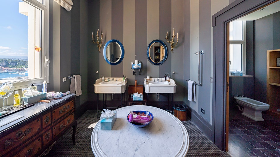 The ensuite bathroom features his and hers sinks.