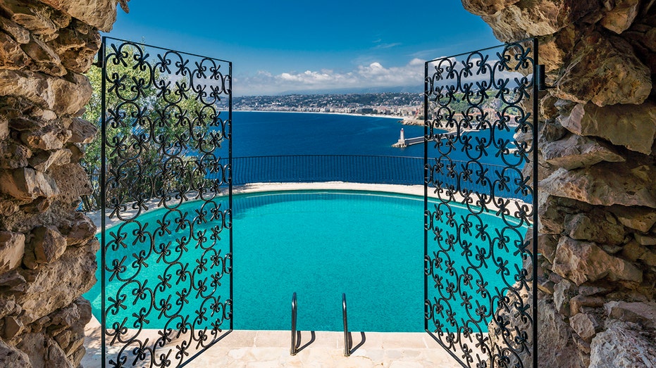 The gym opens up onto the gardens outside and heated outdoor infinity pool.