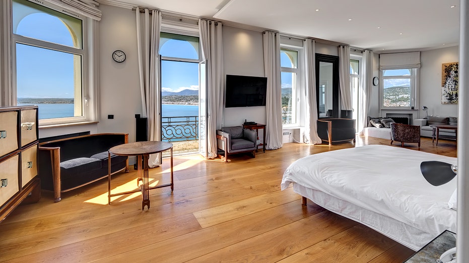 The primary bedroom features a terrace and hardwood floors.
