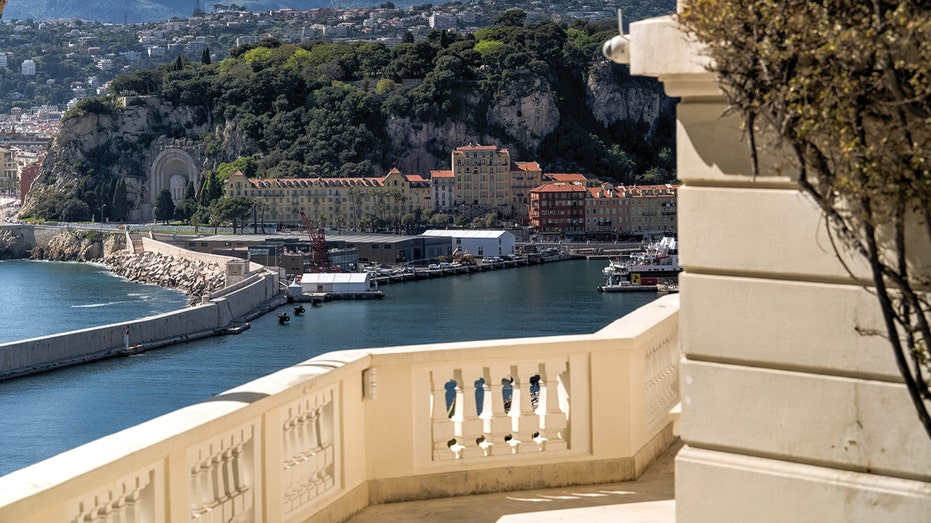 Stone walkways line the home providing views of the Mediterranean.