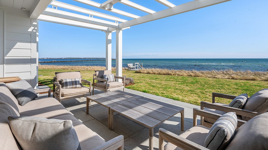 The backyard is characterized by a seating area with ocean views.