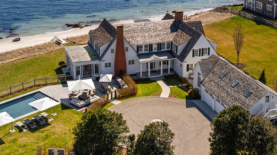 The ocean house features a circular corridor and a three -car garage.