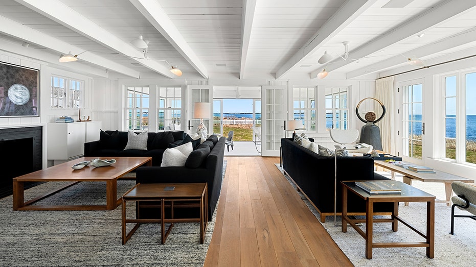 The living room features a fireplace located on firewood and separate living areas.