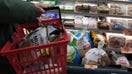NEW YORK, NEW YORK - NOVEMBER 14: A person passes frozen turkeys displayed for sale inside a grocery store on November 14, 2022 in New York City. The price of turkeys, a staple for many Americans at Thanksgiving, is at record highs this year due to inflation and a rise in the price of feed among other cost issues.  (Photo by Spencer Platt/Getty Images) - Fox Business News