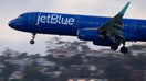 SAN DIEGO, CALIFORNIA - APRIL 20: A JetBlue Airways Airbus A321 airplane approaches San Diego International Airport for a landing from Boston on April 20, 2025 in San Diego, California.  (Photo by Kevin Carter/Getty Images) - Fox Business News