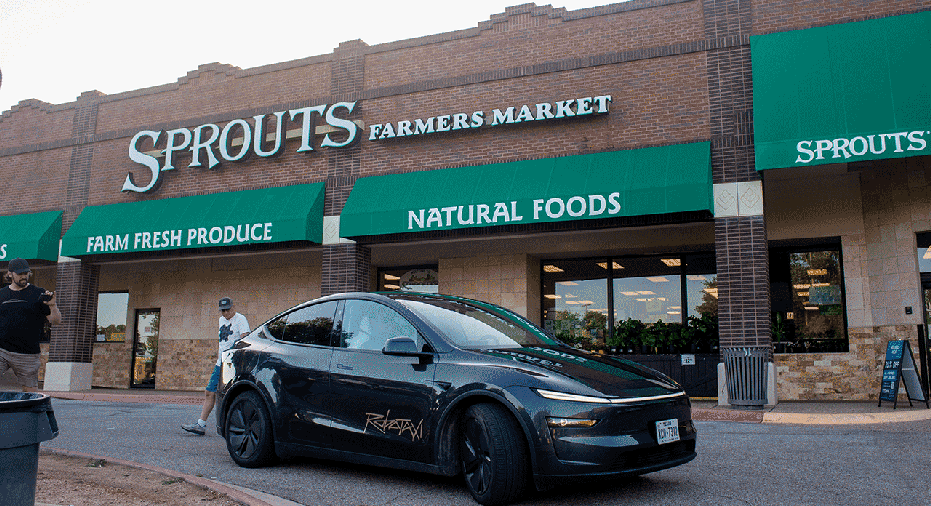 Passengers are dropped off by a Tesla Inc. robotaxi in Austin, Texas, US, on Sunday, June 22, 2025. The launch of Tesla Inc.'s driverless taxi service Sunday is set to begin modestly, with a handful of vehicles in limited areas of the city. Photographer: Tim Goessman/Bloomberg via Getty Images