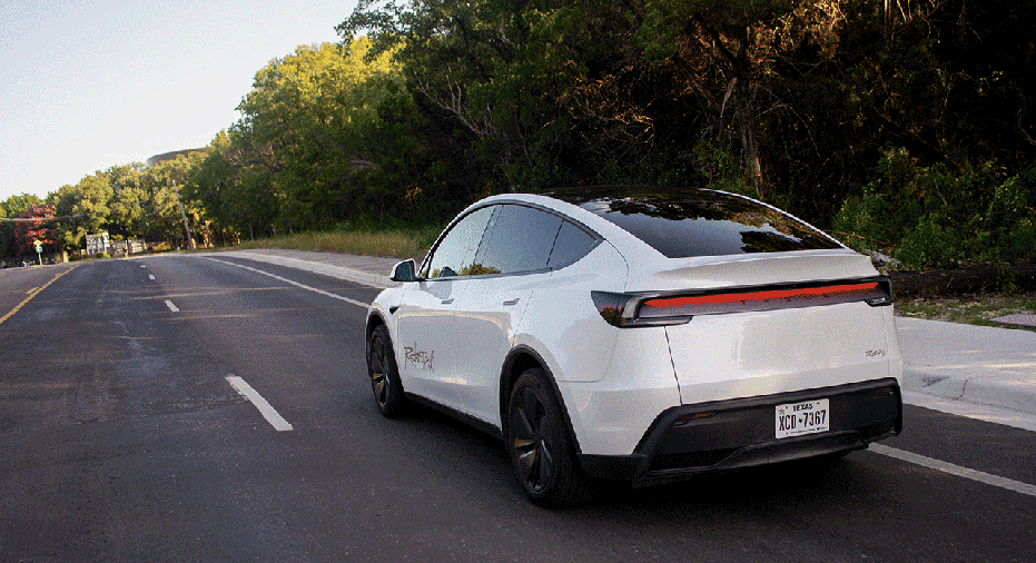 A Tesla Inc. robotaxi on Oltorf Street in Austin, Texas, US, on Sunday, June 22, 2025. The launch of Tesla Inc.'s driverless taxi service Sunday is set to begin modestly, with a handful of vehicles in limited areas of the city. Photographer: Tim Goessman/Bloomberg via Getty Images
