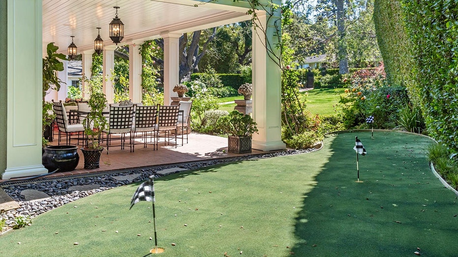 A putting green can also be found in the front yard.