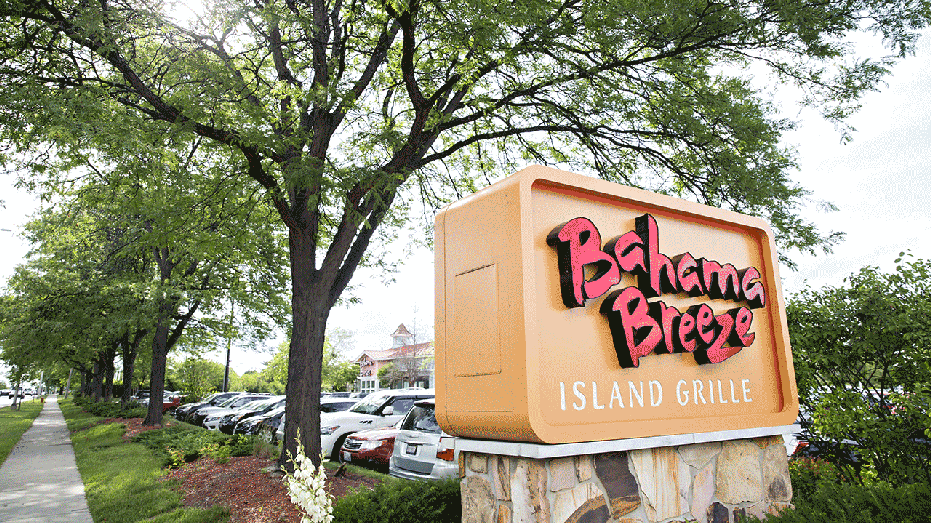 Signage is displayed outside of a Darden Restaurants Inc. Bahama Breeze Island Grille location in Schaumburg, Illinois, U.S., on Thursday, June 22, 2017. Darden Restaurants Inc. is scheduled to reporter earnings figures on June 27. Photographer: Daniel Acker/Bloomberg via Getty Images