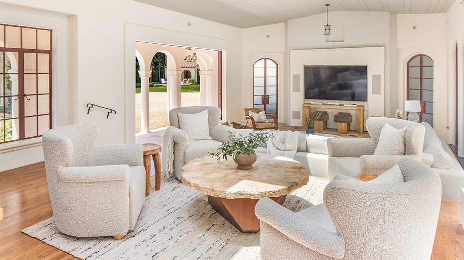 The family room features wooden floors and a floor-to-ceiling sliding door.