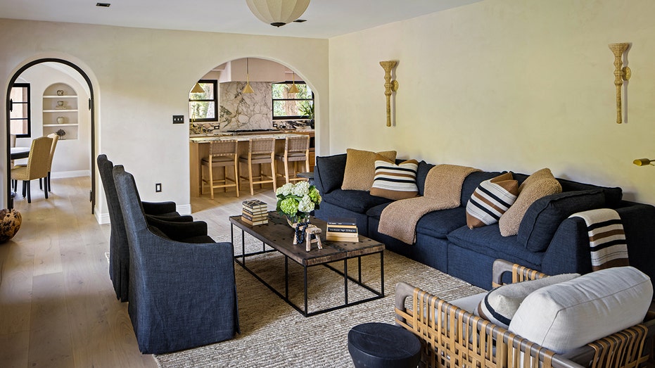 The family room features sconce lighting and double doors leading to the backyard.