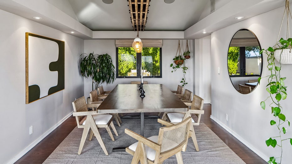 The dining room features a table large enough for eight diners.
