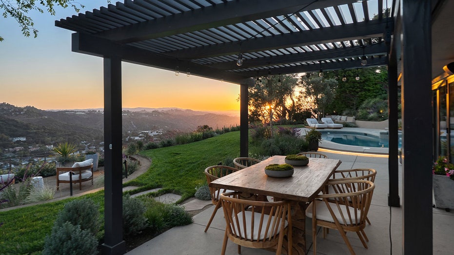 A hillside perch overlooking the mountains is also found in the backyard.