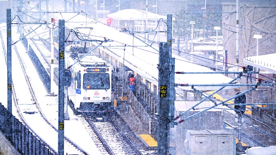 Train in Denver, Colorado covered in snow