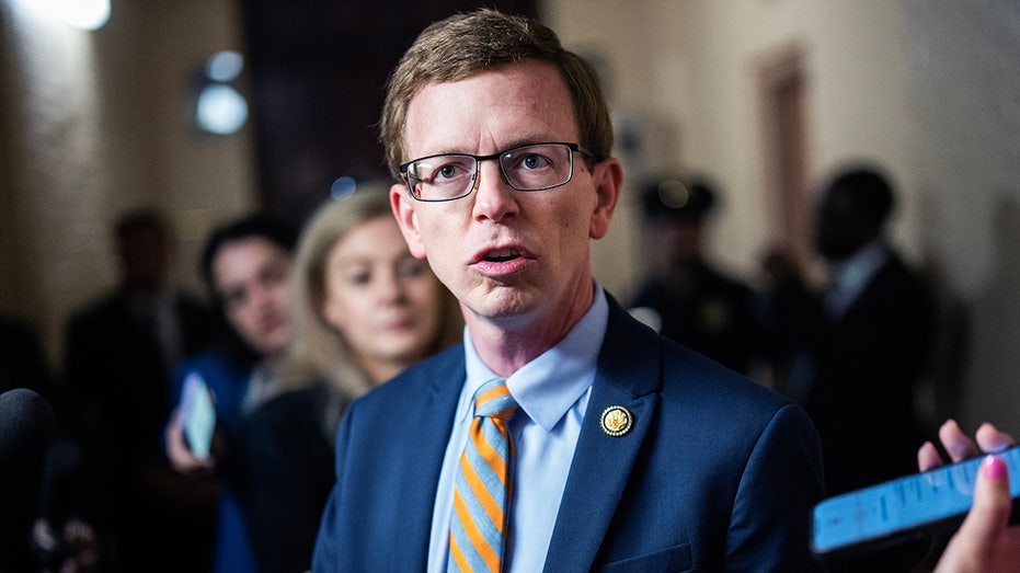 Rep. Dusty Johnson, Rs.D. is talking to a reporter