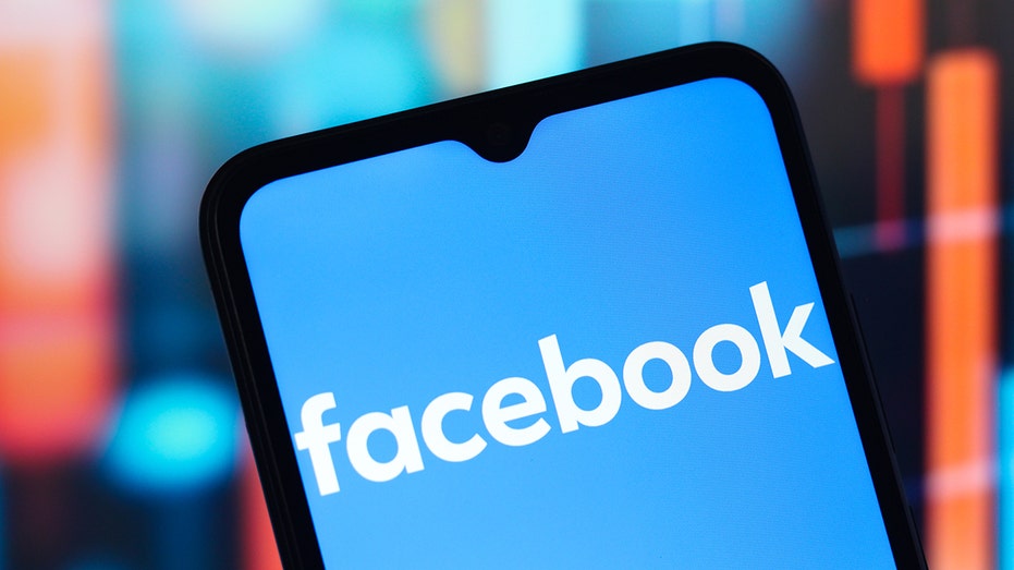 Facebook logo on phone screen
