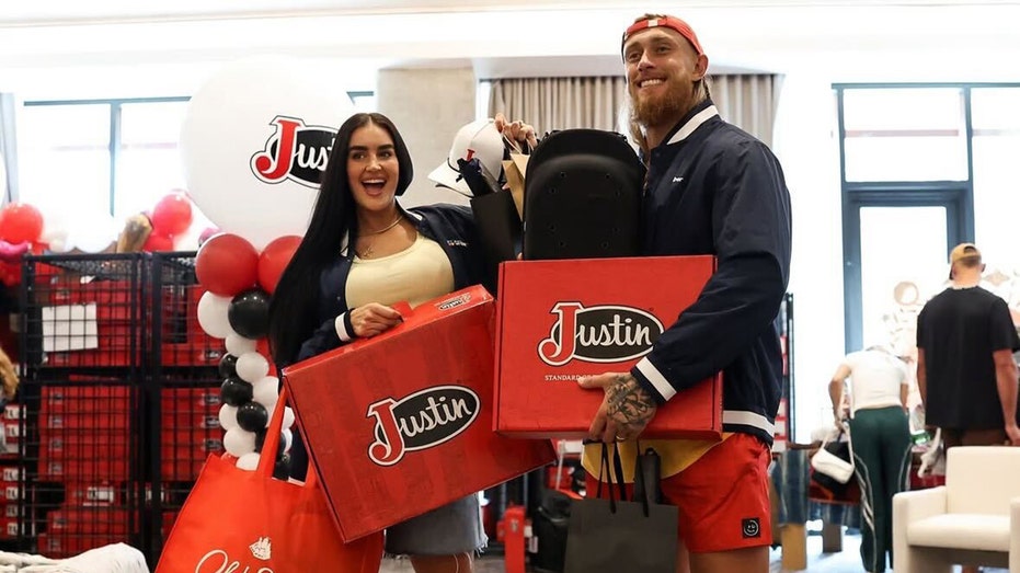 Claire and George Kittle with swag bags