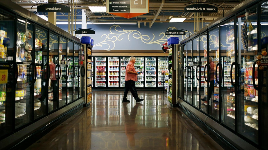 Mann walks in the Kroger Frozen Food Aisle in 2017