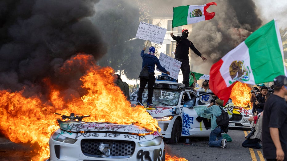 Cars set afire during the Los Angeles riots