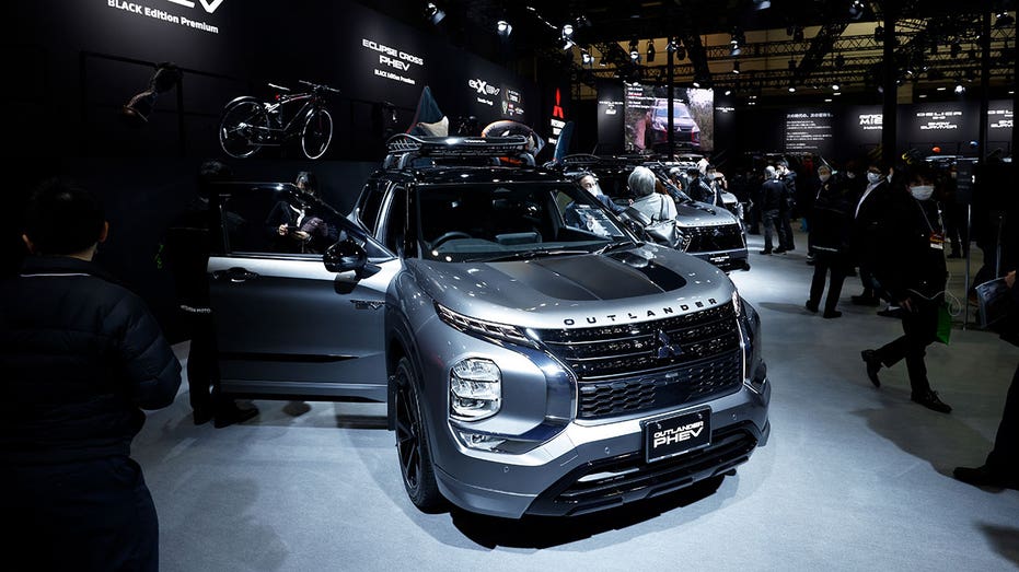 A Mitsubishi Motors Corp. Outlander plug-in hybrid electric vehicle (PHEV) black edition premium vehicle on display at the Tokyo Auto Salon in Chiba, Japan, on Friday, Jan. 13, 2023. The annual event at Makuhari Messe convention center runs through Jan. 15. Photographer: Kiyoshi Ota/Bloomberg via Getty Images