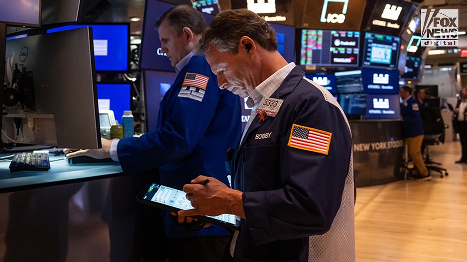 Traders on the floor of the New York Stock Exchange.