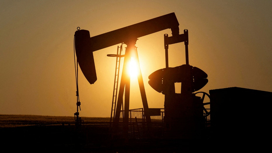 Jack oil pump pumps the oil in a field near Calgary, Alberta, Canada on July 21, 2014.