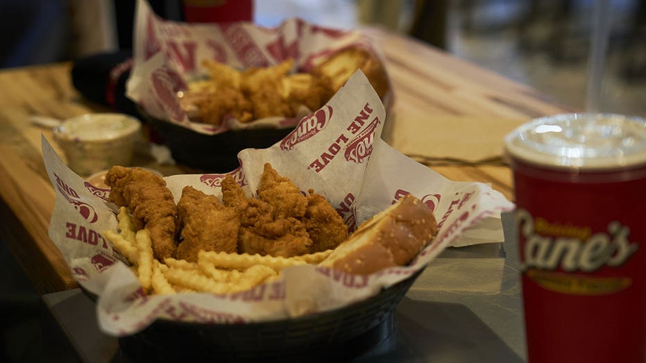 Chicken tender box combo meals during opening day at a Raising Cane's restaurant at the Fulton Mall in the Brooklyn borough of New York, US, on Tuesday, Jan. 30, 2024. The fast-casual restaurant, which has said it's looking to reach $10 billion in annual sales by the end of the decade, paid total dividends of $183 million in fiscal years 2020 to 2022, according to documents reviewed by Bloomberg. Photographer: Bing Guan/Bloomberg via Getty Images
