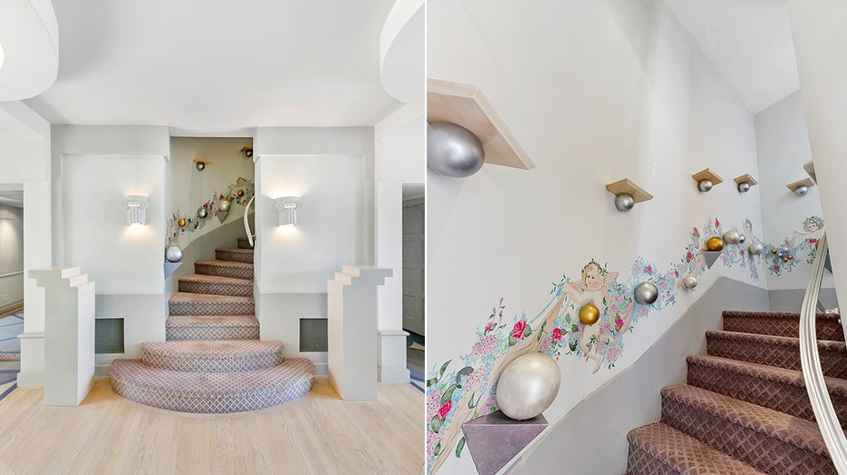 A curved staircase with intricate designs along the walls leads to the upper level of the home.