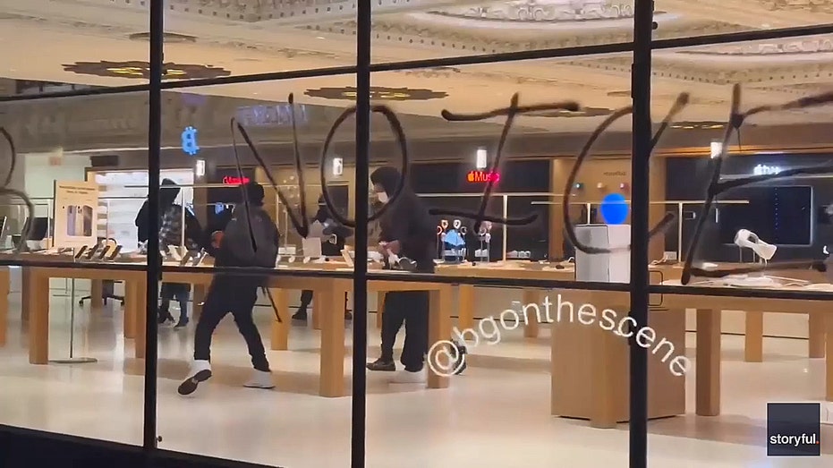 looters stealing Apple products in a store during Los Angeles riot