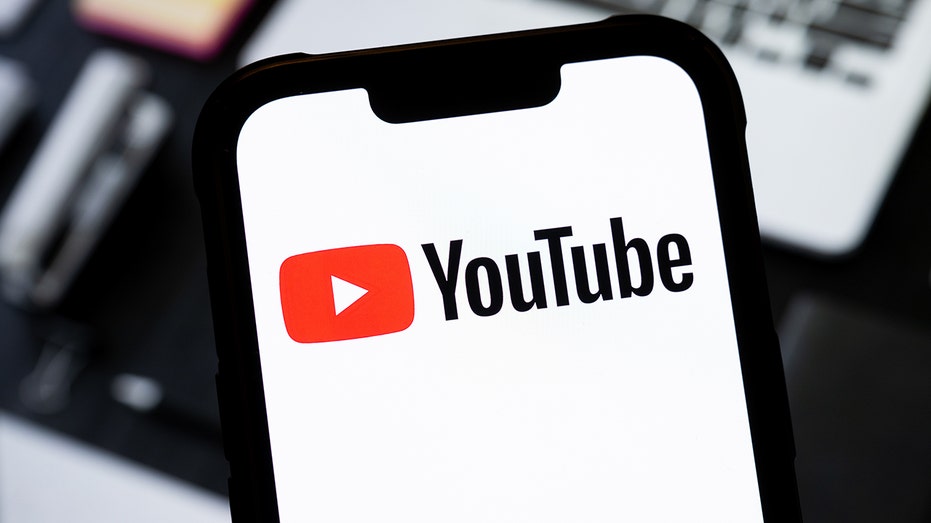 YouTube logo on a phone screen