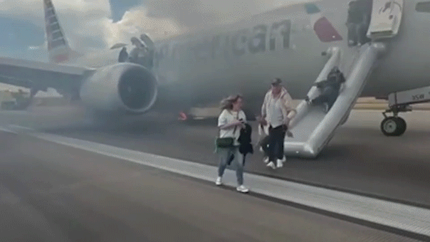 American Airlines passengers caught on camera evacuating smoky plane on Denver tarmac after landing gear issue