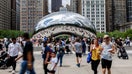 Visitors walk around Cloud Gate otherwise known as The Bean in Millennium Park on June 23, 2024, in Chicago.  - Fox Business News