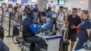 TSA agents verify passengers identities on a checkpoint at Miami International Airport as the Transportation Security Administration (TSA) announced the imminent implementation of its REAL ID enforcement measures at TSA checkpoints nationwide, Wednesday May 07, 2025. (Pedro Portal/The Miami Herald/Tribune News Service via Getty Images) - Fox Business News