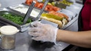 An employee prepares a hot dog at a Portillo's restaurant in Chicago, Illinois, US, on Tuesday, Sept. 27, 2022.  - Fox Business News