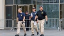 NYPD Crime Scene Unit investigators walk at the scene of a deadly mass shooting in Manhattan, New York City, U.S. July 29, 2025. REUTERS/Kylie Cooper - Fox Business News