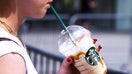 A person drinks Starbucks ice coffee in Krakow, Poland on June 7, 2025. (Photo by Beata Zawrzel/NurPhoto via Getty Images) - Fox Business News