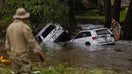 HUNT, TEXAS - JULY 6: Vehicles sit submerged as a search and rescue worker looks through debris for any survivors or remains of people swept up in the flash flooding on July 6, 2025 in Hunt, Texas. Heavy rainfall caused flooding along the Guadalupe River in central Texas with multiple fatalities reported. (Photo by Jim Vondruska/Getty Images) - Fox Business News