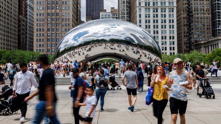 Visitors walk around Cloud Gate otherwise known as The Bean in Millennium Park on June 23, 2024, in Chicago.  - Fox Business News