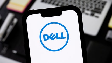 In this photo illustration, a Dell logo is seen displayed on a smartphone.  - Fox Business News