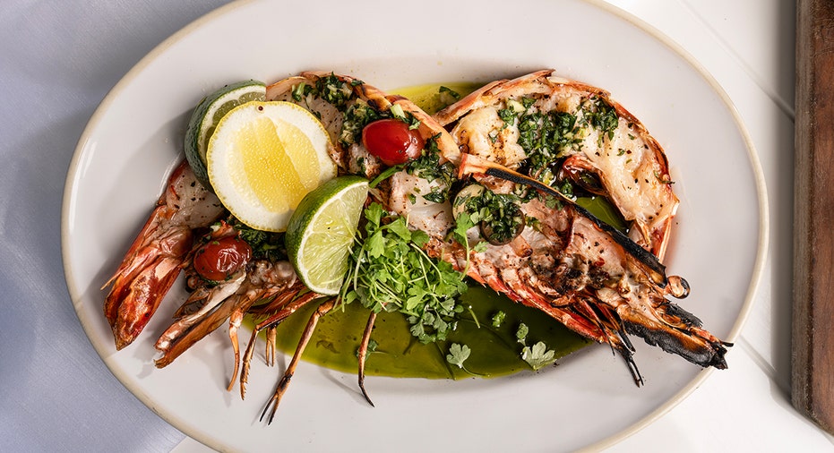 Stuffed fish with lemon and lime slices on a dish