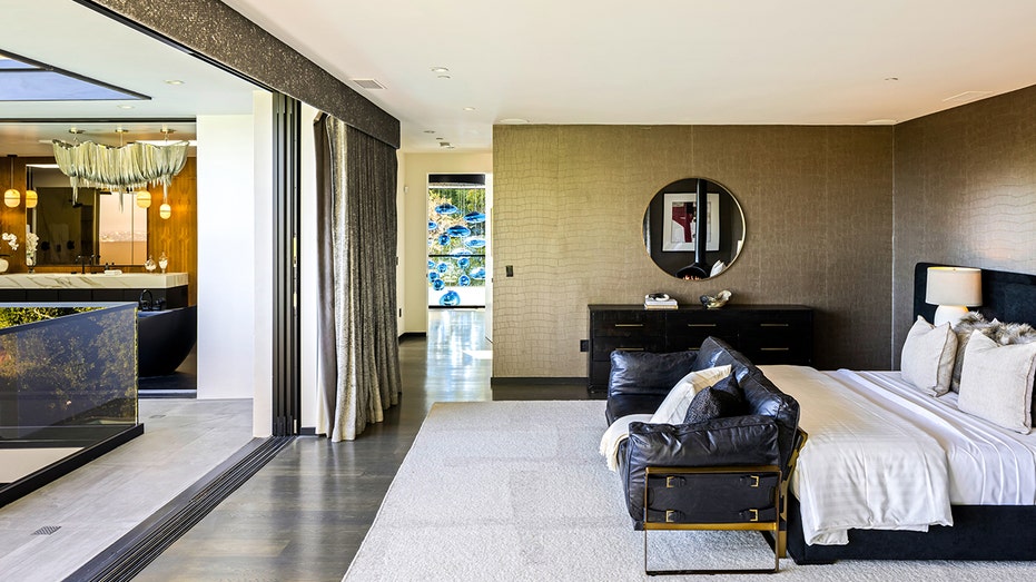 The primary bedroom opens up to a private outdoor terrace.