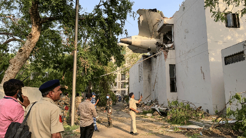 part of jetliner petruding out of building