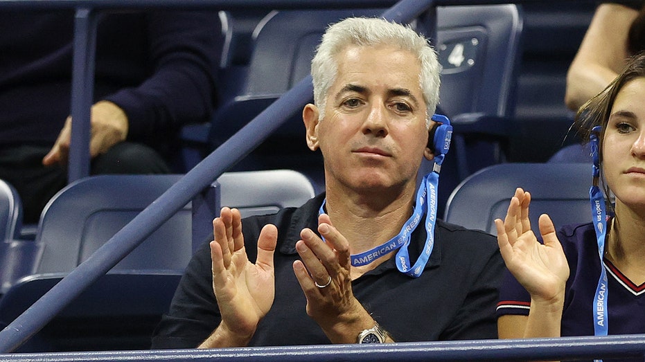 Bill Ackman watches a match