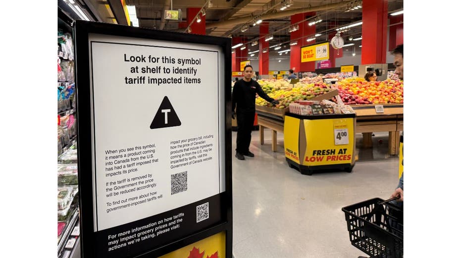 A sign posted in a Canada grocery store identifies products impacted by tariffs