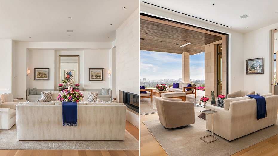 The living room features multiple sitting areas and opens up onto an outdoor terrace.