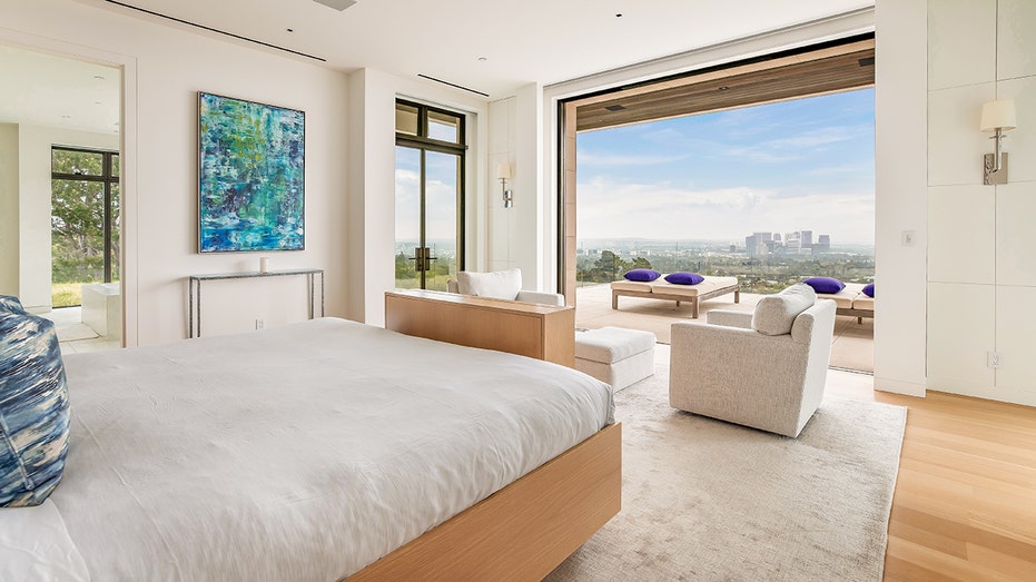 The primary bedroom leads to a private outdoor terrace.