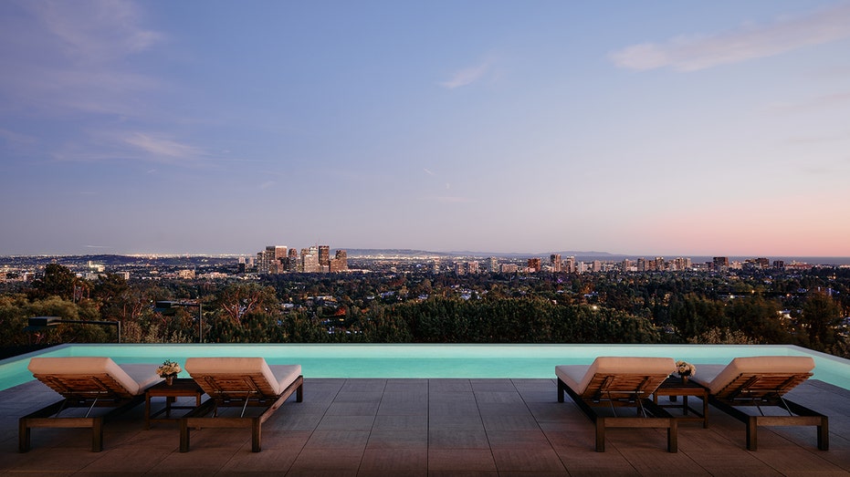 The backyard features a large swimming pool.