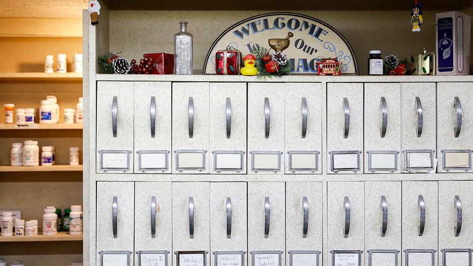 Vintage pharmacy drawers line the walls of Central Drug Store